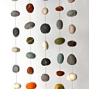 Le rideau en galets de laine feutrée