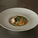 Petits dés de légumes revenus à l'huile d'olive et cuits avec de la poitrine de porc.