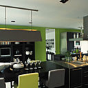 La tonalité du bois foncé de la cuisine Bulthaup est mise en valeur par le mur peint en vert tonique et s’articule autour de la table haute et des tabourets Luz Interiors