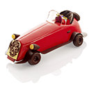 Bûche bolide rouge conçue par Christophe Michalak, à réserver au Plaza Athénée