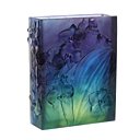 Vase bleu nuit sublimant l’envoûtante orchidée