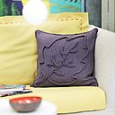 Feuille d'érable, de chêne ou de marronnier: rendez vos fauteuils beaux confortables en les accessoirisant de coussins tricotés