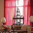 Posé sur un canapé, First Time, un plaid en fourrure, Maison de la Fausse Fourrure, rideaux en taffetas de soie faits maison, cage à oiseaux, Maison Fassier, sur la table basse, Mis en Demeure, un service à thé, Potiron, lampes asiatiques, Shanghaï Tang à Hong Kong, tapis,Hartley’s.