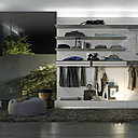 Abacus de Rimadesio : espace ouvert, spacieux, protégé par des portes coulissantes. Un appel au luxe du rangement.