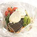 Toujours délicieux en papillote, le cabillaud au Chavignol petits légumes garde son moelleux et toutes ses saveurs.