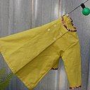 Pour Margot, une robe façon blouse avec bord passe poilé de Petit Pan.