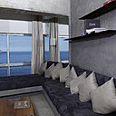 Au salon, le grand canapé d’angle épouse l’architecture d’intérieur et suit les lignes horizontales du paysage maritime qui traverse les baies vitrées. La décoration et les meubles effacent les limites entre extérieur et intérieur.