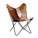 Un fauteuil en fer laqué époxy et revêtement peau de vache naturelle. Fauteuil Papilio, chez Fly.