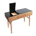 Après une formation d’ébéniste de trois ans en cours du soir à l’école Boulle de Paris, Magali Sénaux se spécialise dans l’agencement. En 2009, elle installe son atelier à Victot-Pontfol, au cœur du Pays d’Auge, où elle conçoit de petits objets de décoration ou des luminaires et assure la rénovation de quelques meubles.