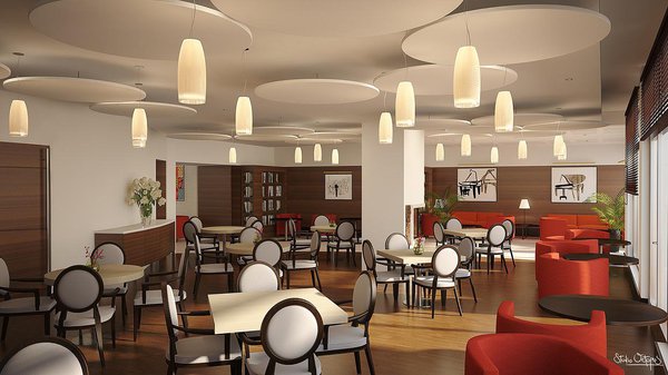 Dans le restaurant de la résidence de Villejuif, au plafond, des panneaux circulaires assurent l’isolation acoustique et participent au décor. Chaises à dossier en forme de médaillon, fauteuils enveloppants, on se croirait dans un restaurant chic et lounge du cœur de Paris.