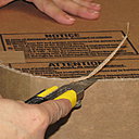 Etape 20. Découpez les éventuels dépassements de carton au cutter.