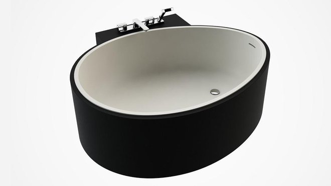 Cette baignoire îlot ovale est encastrée dans un tablier noir en CreaCore mat. L 156,9 cm : à partir de 4800 €. Design Johan Kauppi. Baignoire Ovo Spa. Sdebain.com