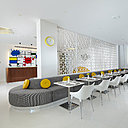 Une longue salle commune prolonge le hall d’accueil, séparé par une cloison légère.