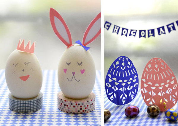 2 vrais œufs trop mignons avec leurs oreilles de lapin et deux oeufs en papier découpé.