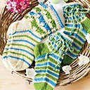 Chaussettes à torsades et bordure torsadée bicolore pour femme.