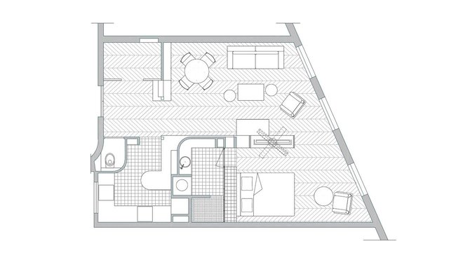 Le nouveau plan de l'appartement  a permis de faire tomber les cloisons pour fluidifier les espaces. La chambre est maintenant semi-ouverte sur le salon et les pièces d'eau (cuisine et salle de bains) bénéficient chacune d'un bel espace dédié.