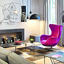 Lobby confortable associant œuvres contemporaines, mobilier contemporain gris et un joli fauteuil Egg d'Arne Jacobsen rose fuchsia pour rehausser l'ambiance.