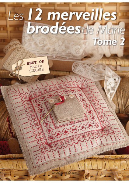 Le coussin surprise en lin clair brodé de feutrine beige.