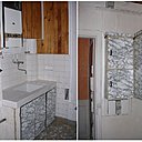 Avant les travaux : une cuisine inesthétique et archaïque avec des aménagements en forme de verrues, qui mêle lambris et stratifié marbré.