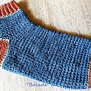 La chaussette de "mino crochète", jolies les côtes et ravissant le talon ocre rouge avec le bleu ardoise!