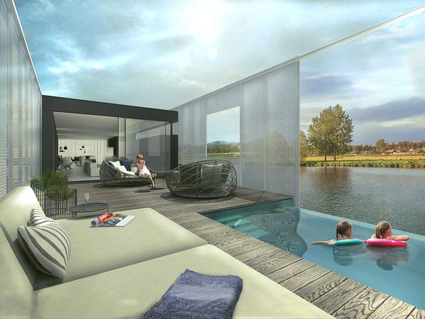 L’espace salon se poursuit à l’extérieur et donne sur une piscine à débordement qui relie la maison à son élément naturel.