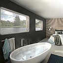 La suite parentale, avec vues sur le fleuve, intègre une salle de bains.