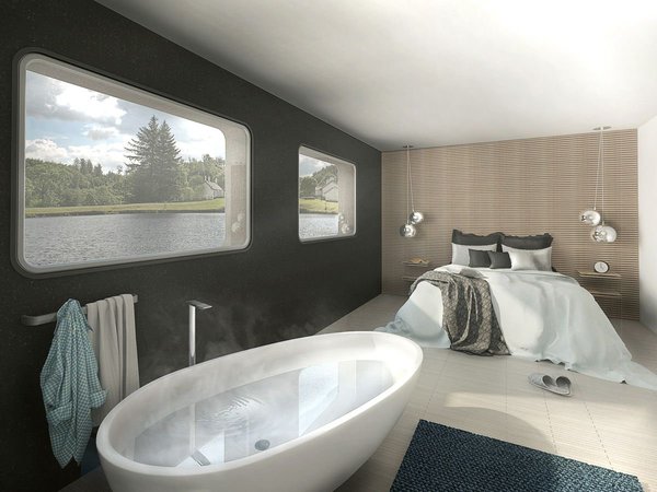 La suite parentale, avec vues sur le fleuve, intègre une salle de bains.