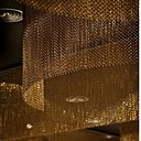 Système de rideaux statiques formant des cylindres pour animer un plafond et jouer avec la lumière des spots. Chaîne en aluminium anodisé haute résistance des couleurs à l’extérieur. Réalisable en deux espacements de chaîne, 15 couleurs brillantes et 13 teintes mates. Création Kriskadécor.