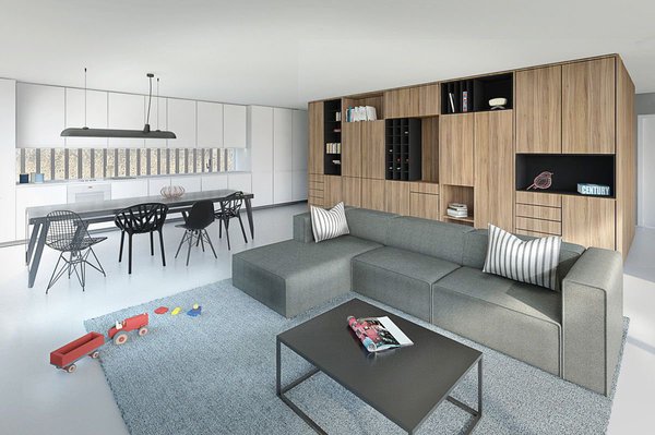 Composé d’une alternance de rangements fermés et de niches ouvertes et éclairées, un meuble central permet la mise en valeur de petits objets à la façon d’un cabinet de curiosités, au cœur d’un volume plus épuré.