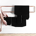 Pierre noire pour radiateur fabriqué à partir de la vitrification des résidus d’épurations des fumées d’incinération des ordures ménagères ou des déchets amiantés du bâtiment. Création Studio GGSV, Gaëlle Gabillet et Stéphane Villard, Carte blanche Via,  2011.