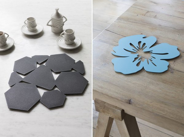 A gauche, centre de table Eurus, avec motifs géométriques, déclinable en 22 coloris. En acier de 2 mm d’épaisseur et patins translucides.  A droite, modèle floral Lips décliné en 19 couleurs.