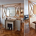 De l’ancienne cloison, on n’a conservé que la cheminée et un muret à son niveau pour adosser un coin repas invisible du salon. Tandis que le miroir trumeau joue la carte de la modernité graphique.