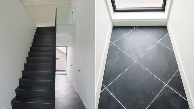 Les zones de circulation ont été traitées pierre naturelle sombre. La pose en diagonale agrandit le couloir.