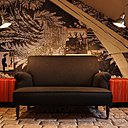 Sous les toits, un effet de dentelle XXL et des pages de carnets de tendances animent le mur qui met en valeur un canapé monochrome posé sur un sol animé d’un effet de trompe-l’œil de pavement ancien. Les lampadaires de type industriel et les poufs carrés apportent une touche plus actuelle. Sous les toits, un effet de dentelle XXL et des pages de carnets de tendances animent le mur qui met en valeur un canapé monochrome posé sur un sol animé d’un effet de trompe-l’œil de pavement ancien. Les lampadaires de type industriel et les poufs carrés apportent une touche plus actuelle.