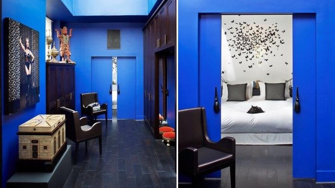 La chambre se découvre derrière deux portes coulissantes à galandage qui se glissent dans la cloison. Les poignées des portes ont été fabriquées à partir de structures de toiture de temple asiatique décapées et repeintes en noir. Le chat noir s’inscrit dans le décor.