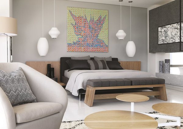 Dans la suite principale, un tableau de Conrad Botes apporte de la luminosité à la pièce à dominante gris neutre.