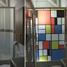 Pose d’un film imprimé Mondrian sur une paroi de douche